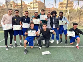 Dr. Siddiq Afifi congratulates the futsal team at Thebes Academy